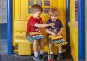 young children communicating with PECS on the playground