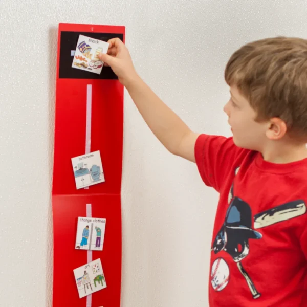 Boy placing picture card on timeline.